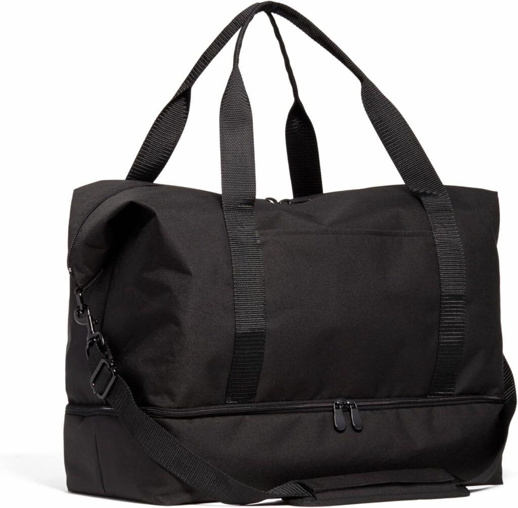 Black Lo & Sons duffel bag with shoulder strap and top handles. Lo & Sons Review.