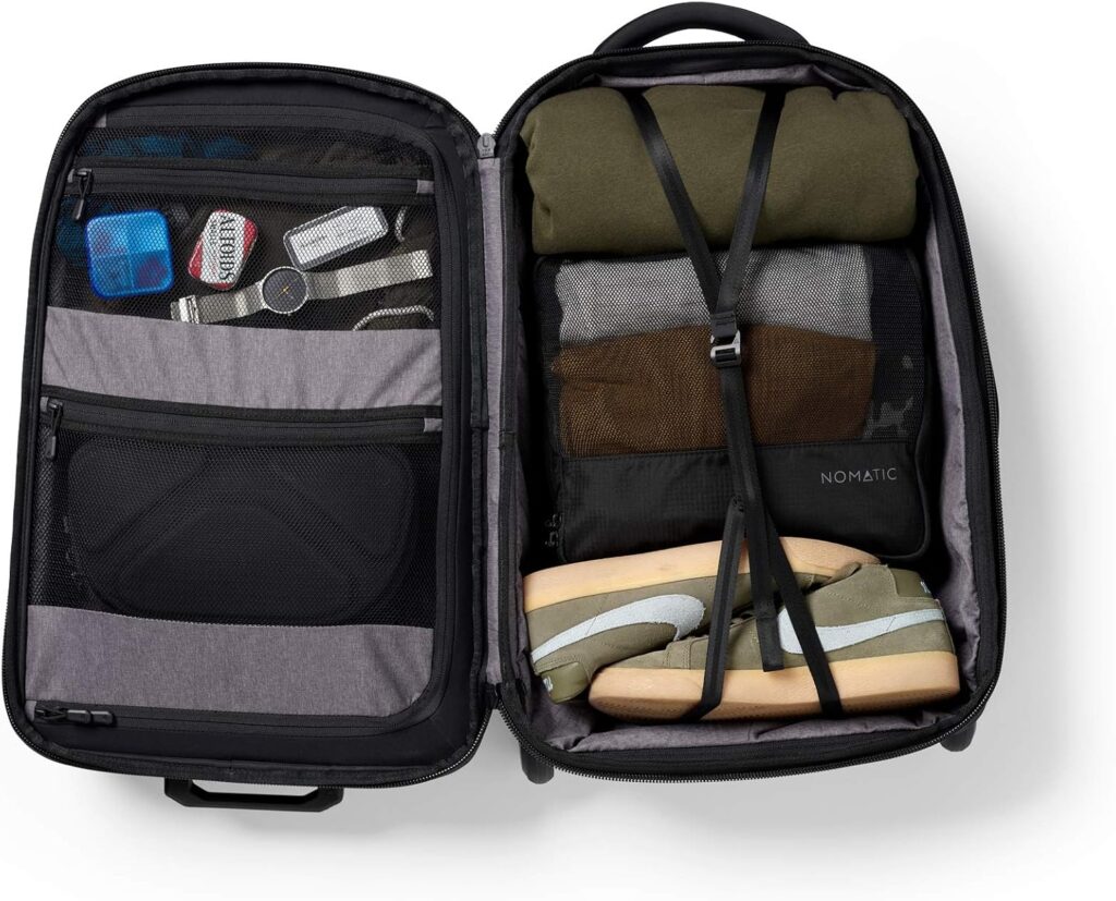 Open Nomatic Navigator Carry-On Review showing packed clothes, shoes, and accessories.