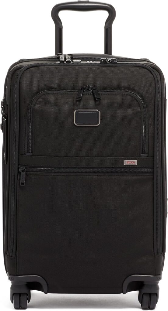 Black Tumi carry-on luggage, ideal for business or leisure travel, with telescoping handle and multiple pockets.