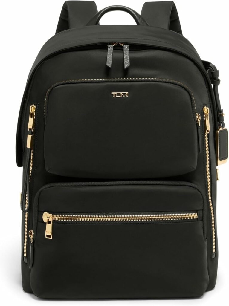 Black Tumi Voyageur backpack with gold zippers, part of a Tumi Voyageur Review.