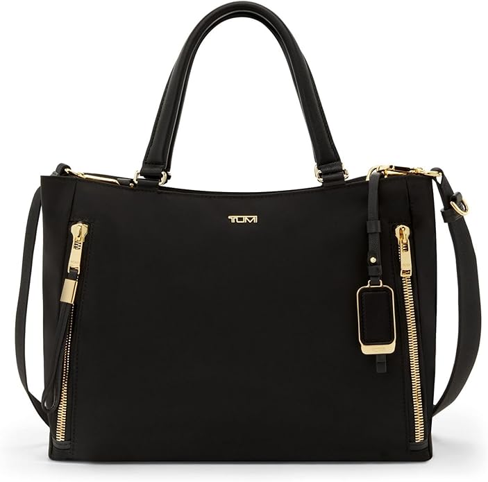 Black Tumi Voyageur bag with gold zippers and handles, part of a Tumi Voyageur Review.
